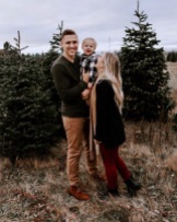 family photo session at a Christmas tree farm